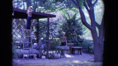 1958: two children active in a courtyard with trees and facilities TUCSON,