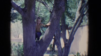1958: a topless kid is seen on a rope TUCSON, ARIZONA