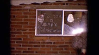 1958: holiday decorations hung on wall read "to you a merry christmas" TUCSON,