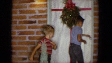 1958: mother and children going inside at christmas TUCSON, ARIZONA