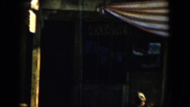 1958: boy pointing something above to a lady standing among a crowd TUCSON,