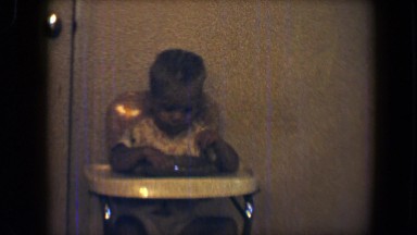 1959: the boy having food very stylish on their kid chair DISNEYLAND, CALIFORNIA