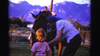 1968: Mother with Scarf Hands Bridle to Little Girl with Pony in Cottonwood, Arizona