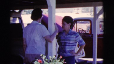 1968: women talking outside in front of truck with hood up COTTONWOOD, ARIZONA