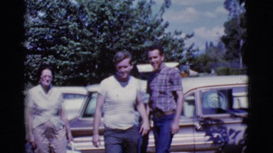 1968: diverse group of acquaintances disperse from a parking lot. dog attempts