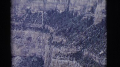 1968: high view of mountains valleys and canyons that are dry and deserted