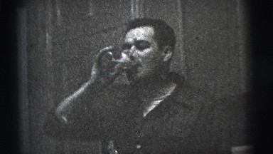 1956: A Man Smoking at an Indoor Party in New York City
