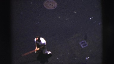 1956: a downward view of various pedestrians on a dirty, littered city street