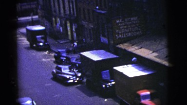 1956: Three Men Walk Past Two Ladies Standing by a Car, New York City