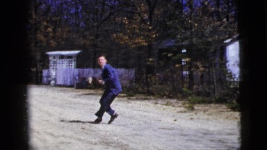 1956: a man wearing a tuxedo throws a football while outside. NEW YORK CITY