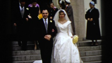 1962: newly married couple leaves the place of the ceremony smiling NEW YORK