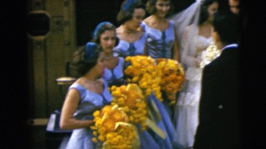1962: wedding party is being directed during a photo session