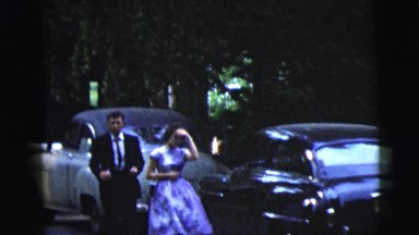 1962: dressed up couple walking down the street NEW YORK CITY