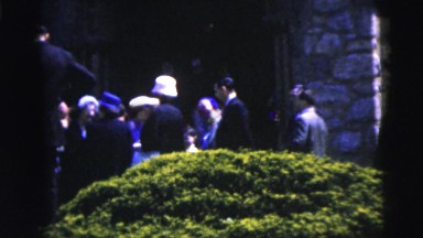 1962: gathering of formal dressed people with classic cars NEW YORK CITY