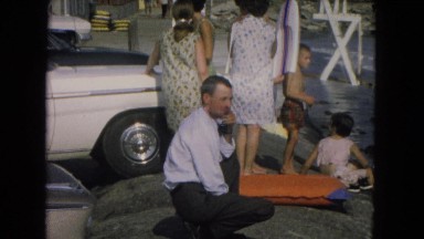1967: a man is sitting nearby girls. NEVADA