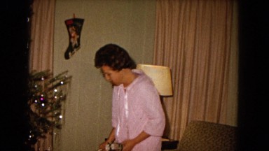 1967: mother and children are decorating x-mas tree with presents NEVADA