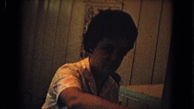 1967: mother and daughter looking at each other inside in kitchen NEVADA