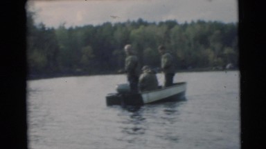 1967: Three Men Having Fun Fishing on a Lake in a Boat in Camden, New Jersey