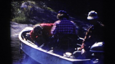 1956: a group of people traveling in several small boats on the water FLORIDA