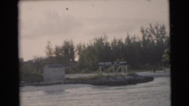 1956: the shore of a lake with many houses and buildings FLORIDA