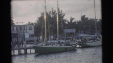 1967: boat watching in the harbor at sunset from the deck of the family boat
