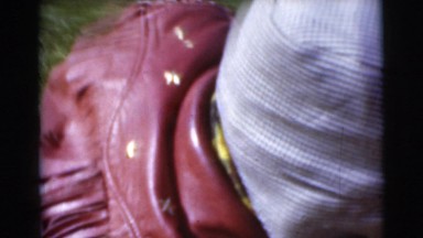 1956: a young boy dressed in a jacket performing activities in a rural area