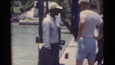 1956: fishermen talking on a pier. FLORIDA