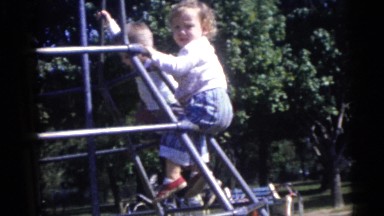 1967: little and beautiful girl pirouettes with her friend at the park CAMDEN,