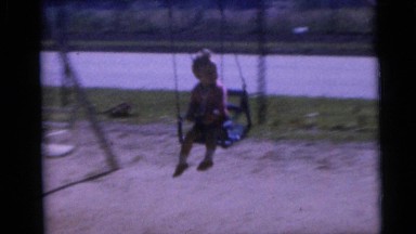 1967: Two Children Playing on Swing Set in Camden Backyard