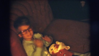 1967: young boy with glasses on sofa on christmas CAMDEN, NEW JERSEY