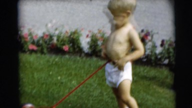 1967: little boy in underpants takes responsibility and helps out with the yard