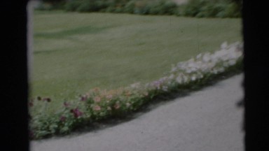 1954: toddler bounces excitedly down a driveway PENNINGTON, NEW JERSEY