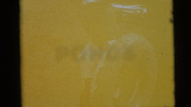 1954: Two Young Kids Outside Playing With Round Donut-Shaped Inner Tubes