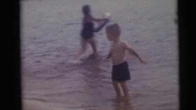 1967: Young Children Splashing in Lake Near Tubers, Camden, New Jersey