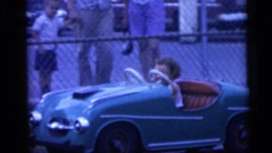 1954: Child Playing in Small Toy Car in Pennington, New Jersey