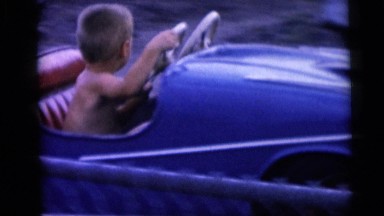 Young Boy Enjoys Car Ride at Miniature Golf Park Camden, New Jersey