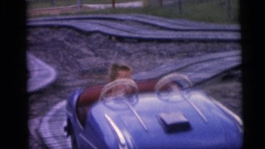 1954: A Child Sitting in an Automatic Mobile Ride by Himself Pennington