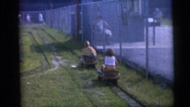 1954: Children Riding Hand-Powered Cars on Fenced Track in Pennington, New Jersey