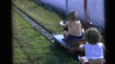 1967: Cute Kids Playing with Miniature Trains Around a House in Camden, New Jersey