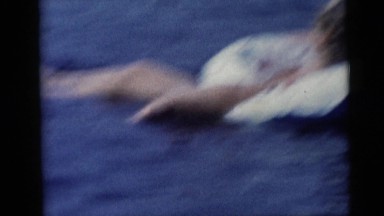 1967: Family Time at the Lake as Children Swim and Parents Supervise