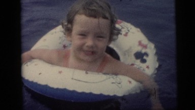 1967: a little boy swims using swim guard in a swimming pool CAMDEN, NEW JERSEY