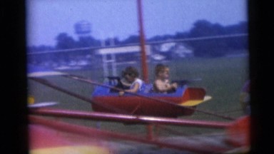 1967: Children Riding Carnival Rides at a Town Fair in Camden, New Jersey
