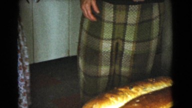 1968: Two Women Baking Bread Together in Kitchen with Dog
