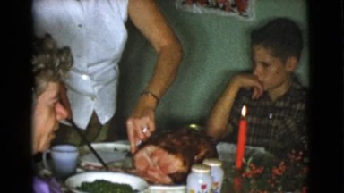 1968: mother is chopping the meat and serving on the table COTTONWOOD, ARIZONA