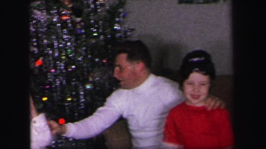 1972: childrens are celebrating a festival with his father or relatives