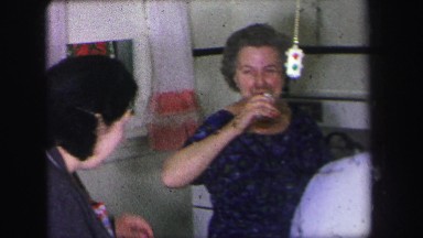 1972: a group of women gathered in the kitchen, appearing to be cooking