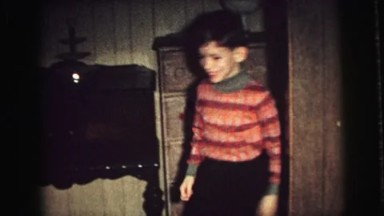 1974: children running to christmas tree to open gifts. LYNBROOK, NEW YORK