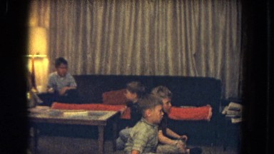 1964: four kids are sitting on the floor and couch to watch something