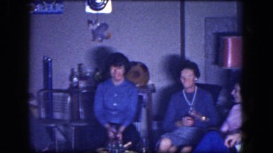 1964: group of men and women sitting in a lounging area drinking, smoking