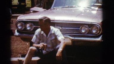 1968: a man is seen sitting near a car COTTONWOOD, ARIZONA
